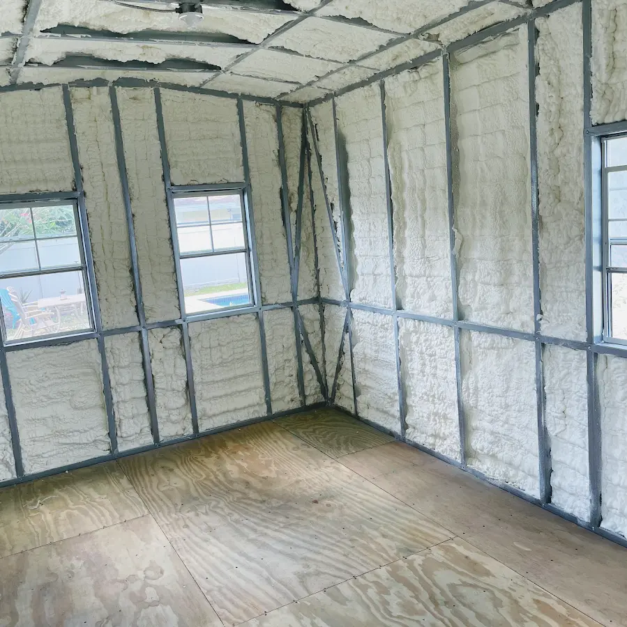 Closed-cell spray foam insulation applied to wall cavities in a residential project in Richmond Heights